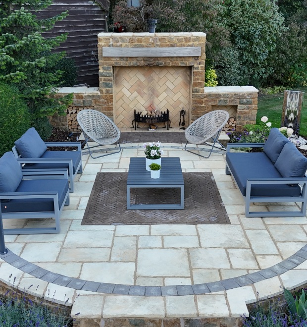 Outdoor fireplace with surrounding patio